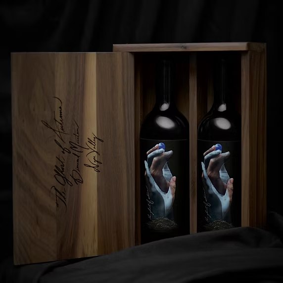 Two bottles seated in an engraved walnut box, the lid lettered The Ghost of Autumn, Diamond Mountain, Napa Valley.